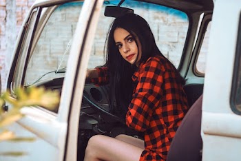 Woman Sitting in a Vehicle