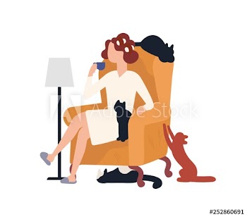Woman sitting in armchair with cats