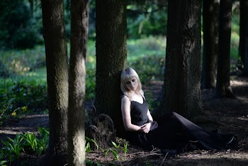 Woman Sitting in Forest