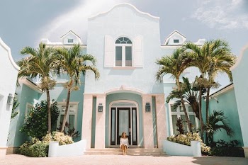 woman sitting in front of building