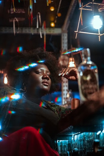 Woman Sitting in Mini Bar