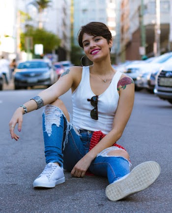 Woman Sitting In The Middle Of The Road