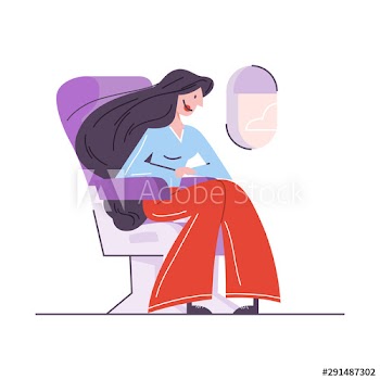 Woman sitting in the plane at the window