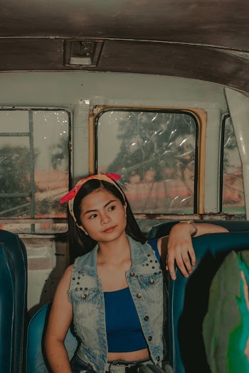 Woman Sitting Inside A Bus