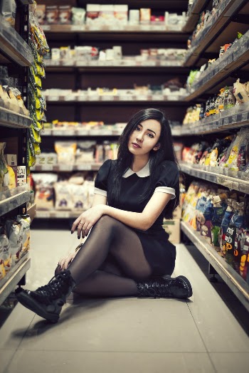 Woman Sitting Inside Store