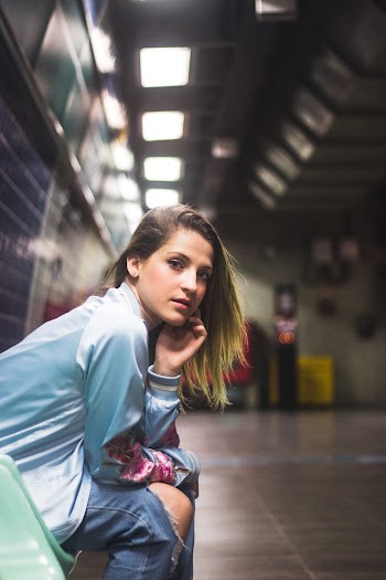 Woman Sitting Inside Subway