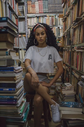 Woman Sitting Inside the Library