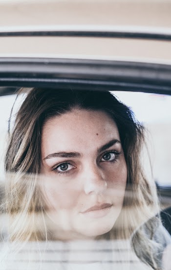 Woman Sitting Inside Vehicle
