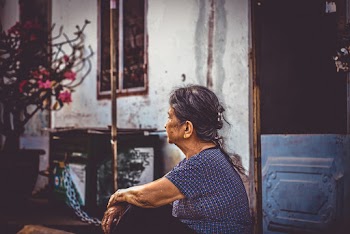 Woman Sitting Near Door