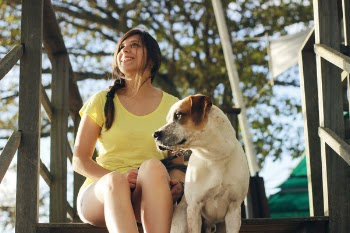 Woman Sitting Near the Jack Russell Terrier