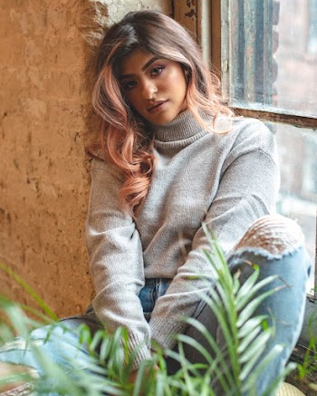 Woman Sitting Near Window