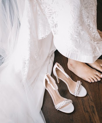 Woman Sitting Next Top Open Toe Sandasl