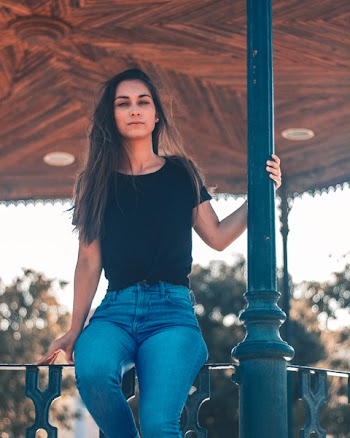 Woman Sitting Om Fence