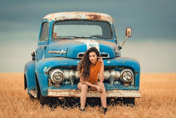 Woman Sitting On A Bumper