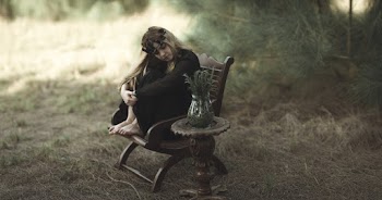 Woman Sitting on A Chair