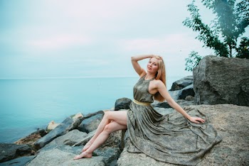 Woman Sitting on a Rock