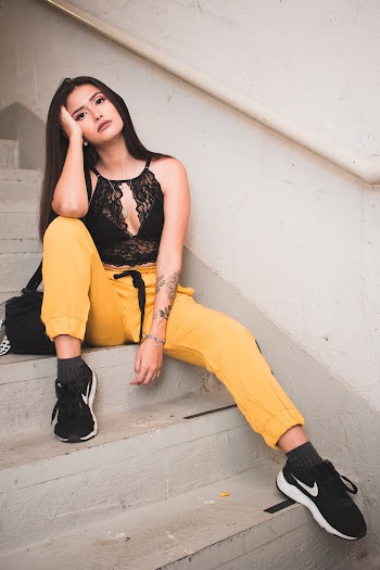 Woman Sitting On A Stairway