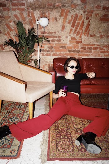 Woman Sitting On Area Rug