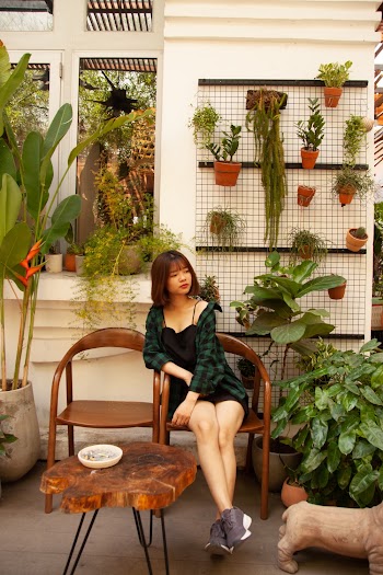Woman Sitting On Armchair