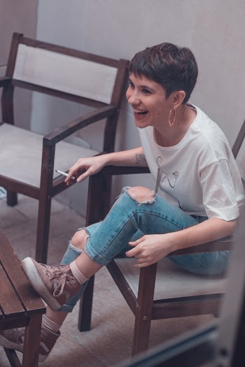Woman Sitting on Armchair