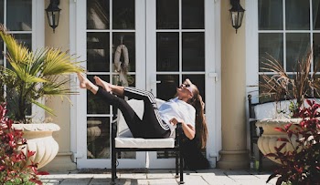Woman Sitting on Armchair Outdoors