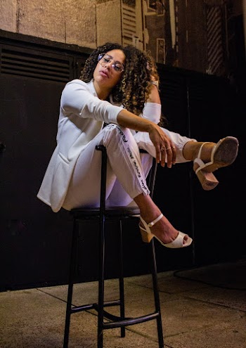 woman Sitting on Bar Stool