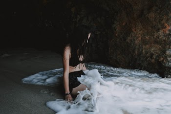 Woman Sitting on Beach