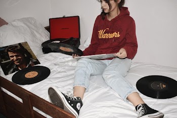 Woman Sitting on Bed