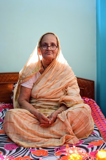 Woman Sitting on Bed