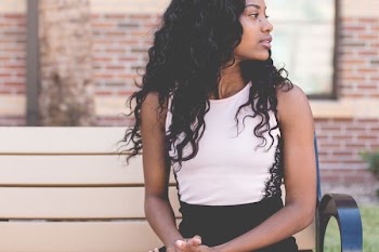 woman sitting on bench