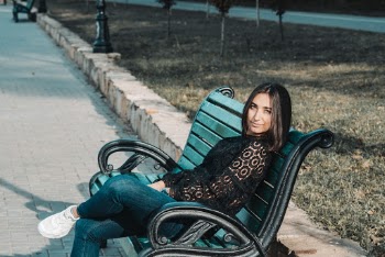 Woman Sitting on Bench
