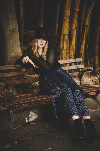 Woman Sitting on Bench Outdoor