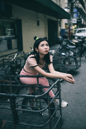 Woman Sitting on Bike