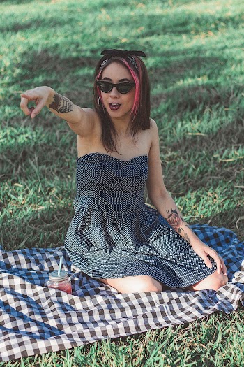 Woman Sitting On Black And White Checked Textile