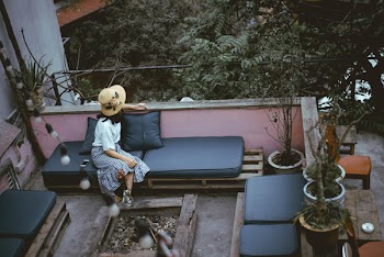 Woman Sitting on Black Leather Padded Chair