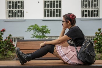 Woman Sitting on Brown Bench