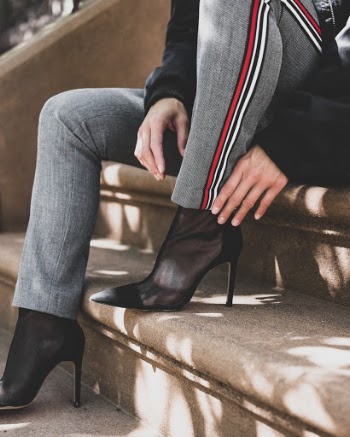 Woman Sitting on Brown Concrete Steps Outdoors