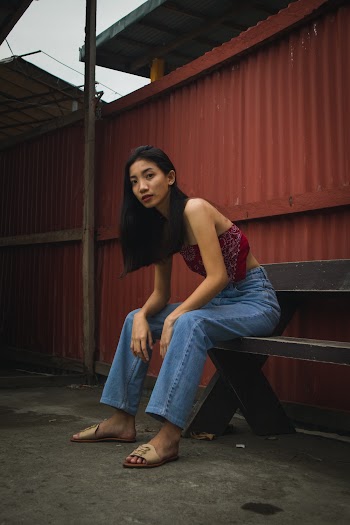 Woman Sitting on Brown Wooden Bench