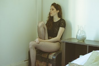 Woman Sitting on Brown Wooden Chest Box