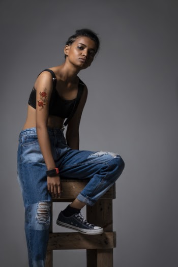 Woman Sitting On Brown Wooden Stool