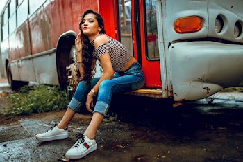 Woman Sitting on Bus Steps