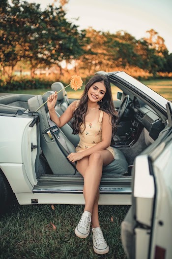 Woman Sitting on Car