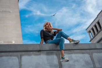 Woman Sitting on Cement