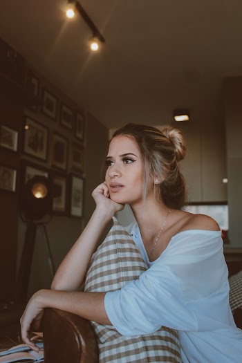 Woman Sitting on Chair