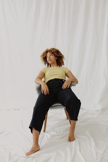 Woman Sitting on Chair