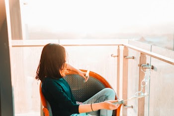 Woman Sitting On Chair
