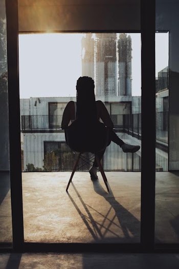 woman sitting on chair during daytime