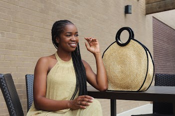 Woman Sitting on Chair Outdoors