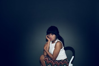 Woman Sitting on Chair Put Her Hand on Chin