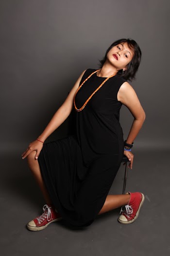 Woman Sitting on Chair Striking a Pose